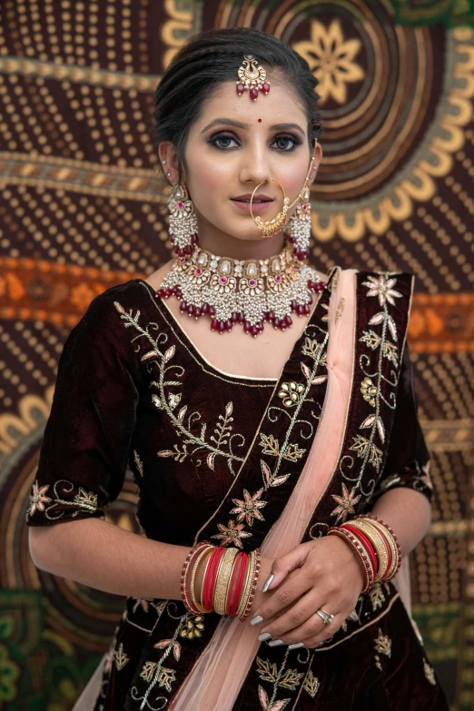 a woman in indian costume posing for the camera