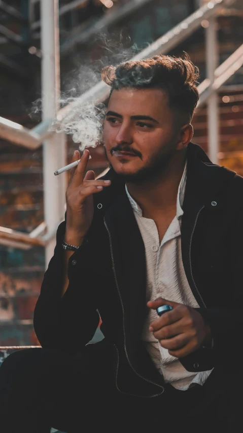 man with cigar in his mouth is sitting on stairs