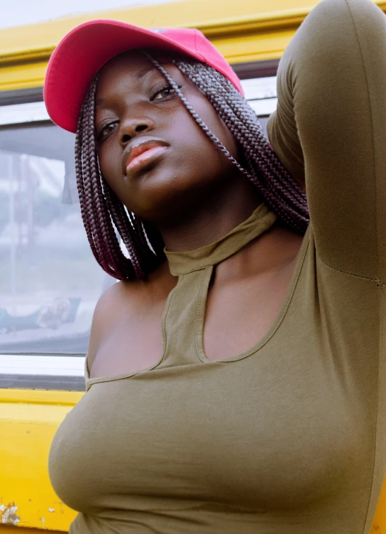 a very pretty young lady in an off shoulder shirt and hat