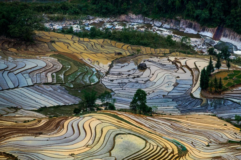 terraces near a town are seen from the sky