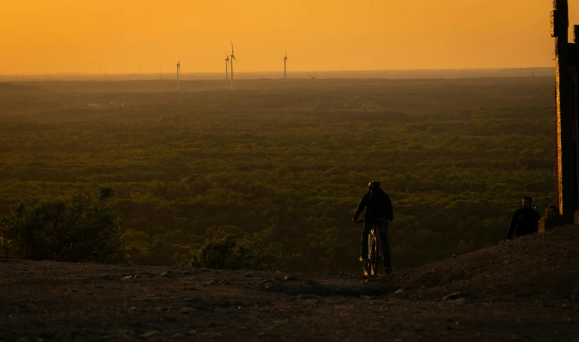 a person riding a bike down a hill