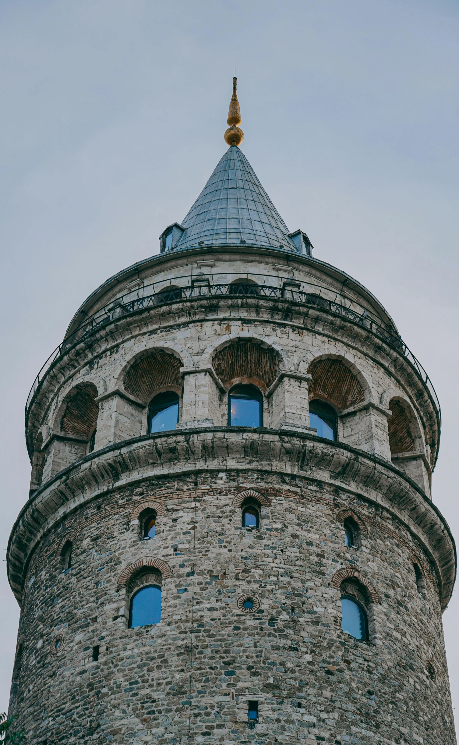 a tall tower with arched windows on it's side