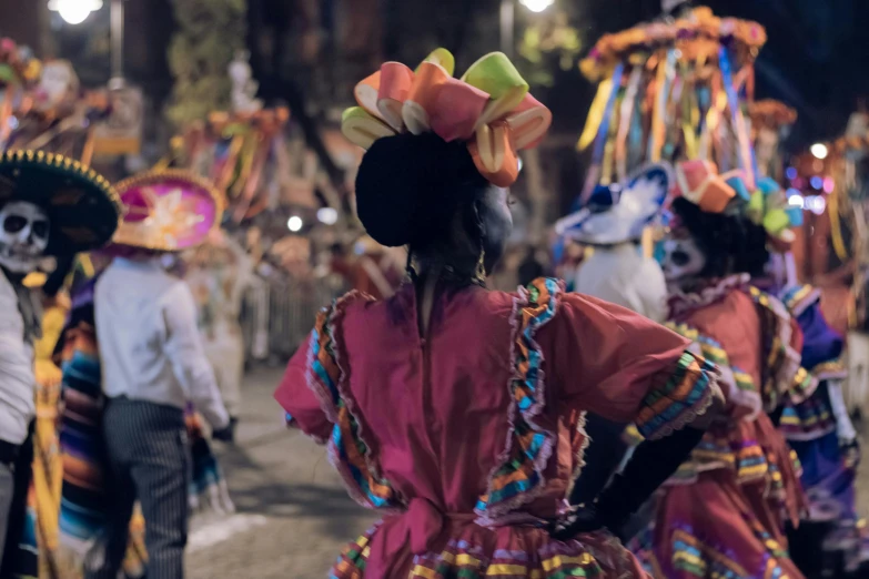 a group of women in costume at a festival