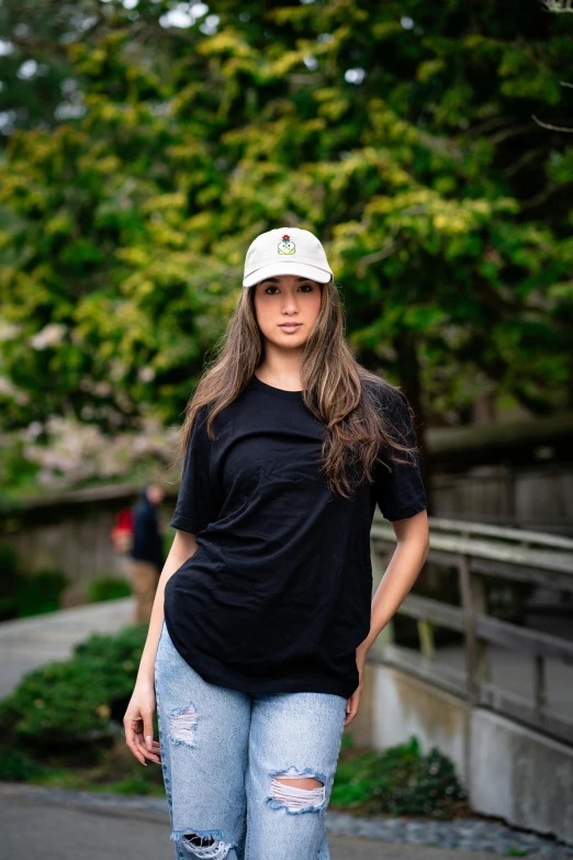 the girl in a black shirt is standing on a skateboard