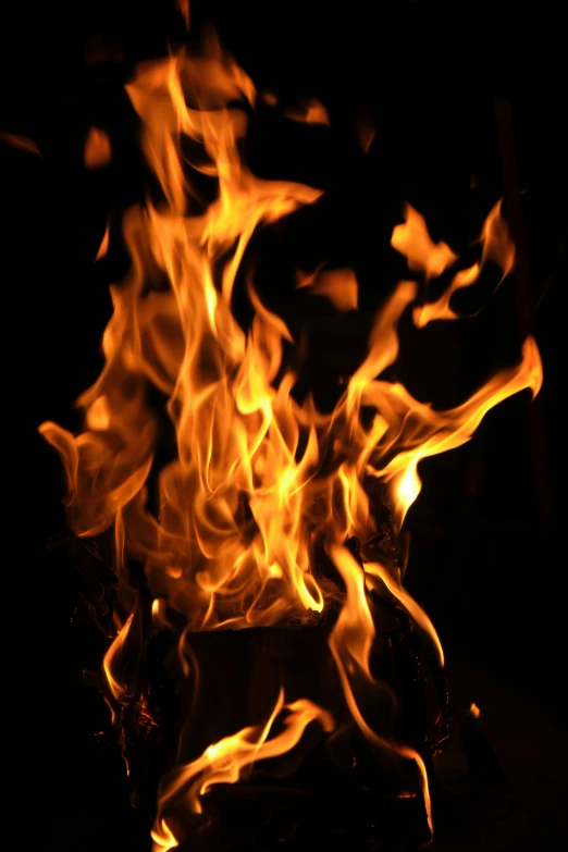 fire flames glowing brightly on a dark surface