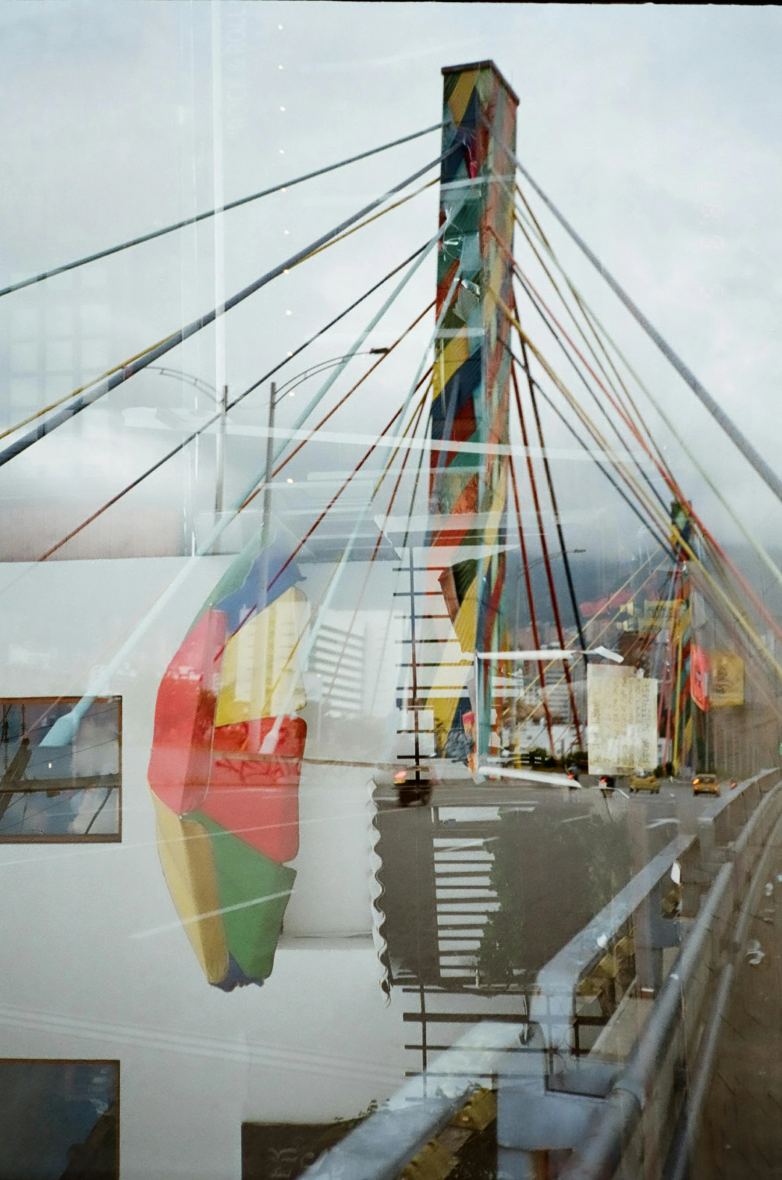 the reflection of a bridge is seen in a window