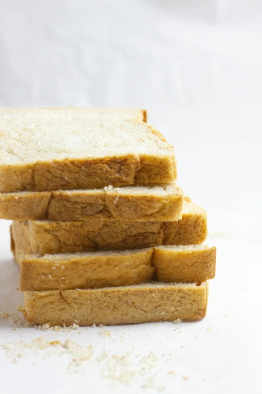 sliced up bread on white background on table