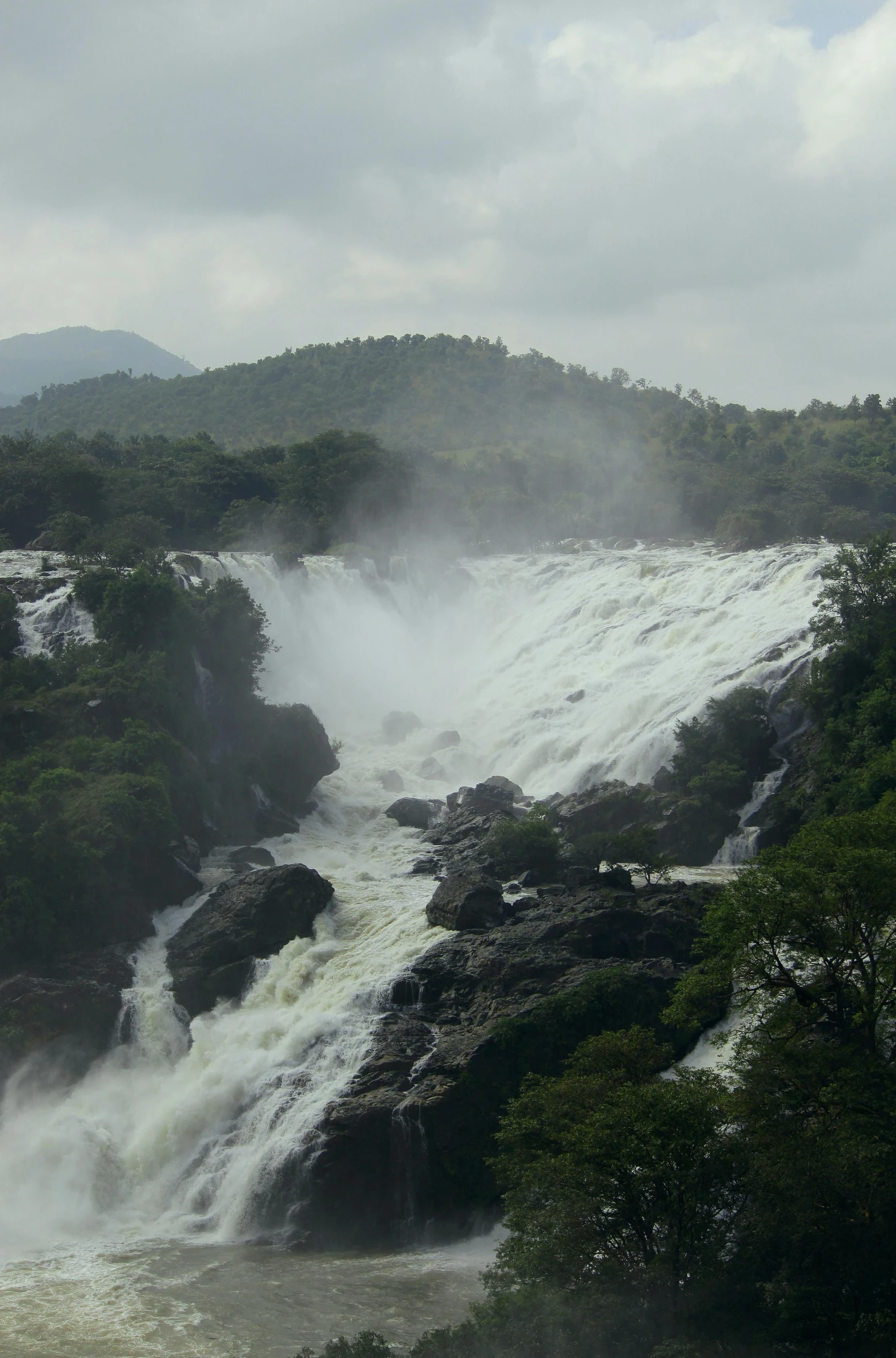 a waterfall in the middle of a body of water