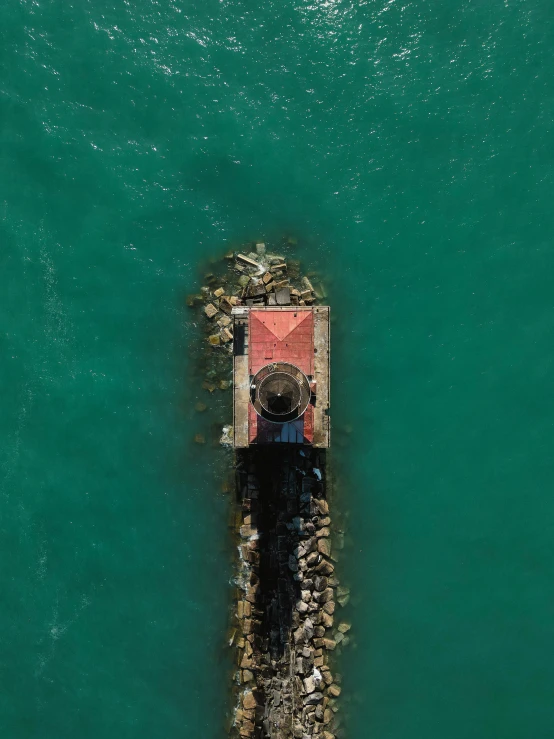 a small house on a barge in the water