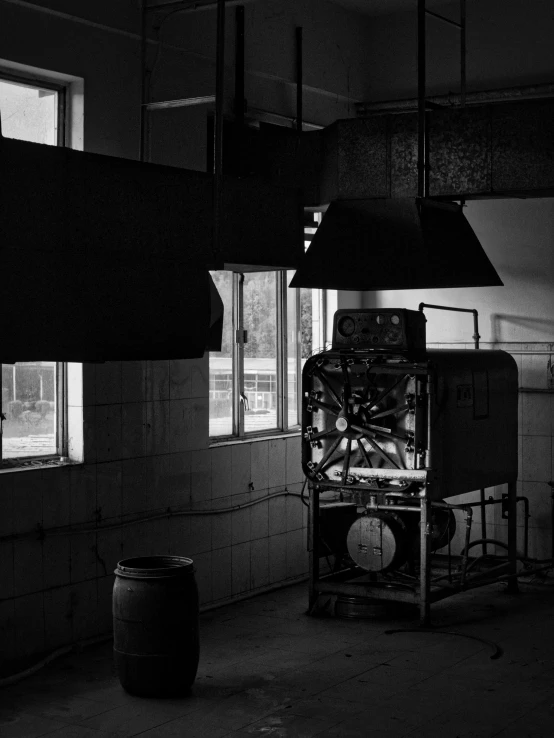 black and white po of large heater and two pots