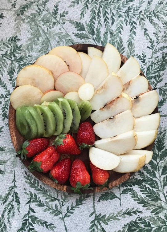 a plate topped with lots of sliced fruit