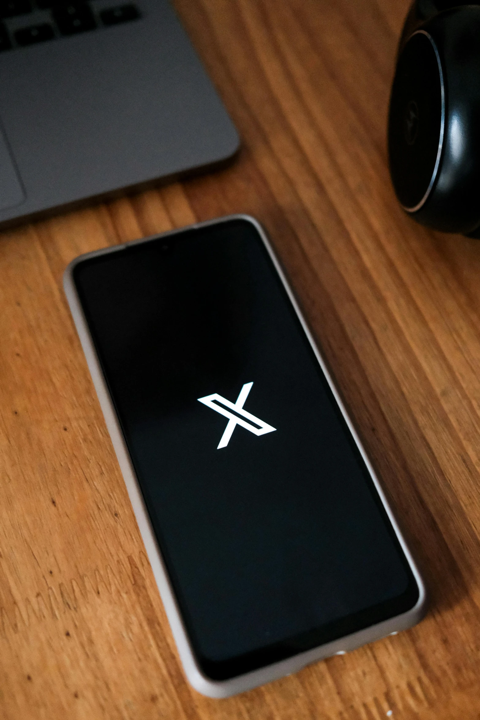 this is an image of a laptop with the x logo on the screen