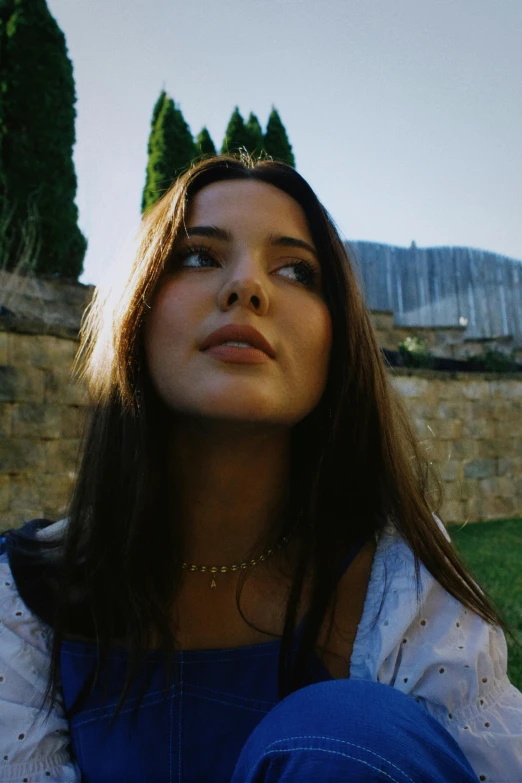 a close up of a woman wearing an elegant necklace