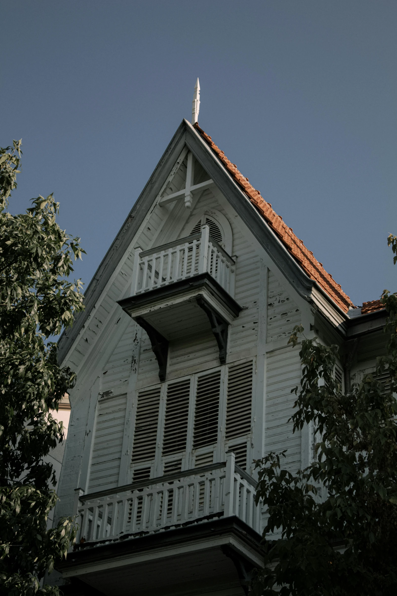 a white building with a clock tower and stained glass windows