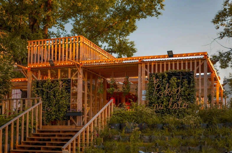 a building with trees and stairs next to it