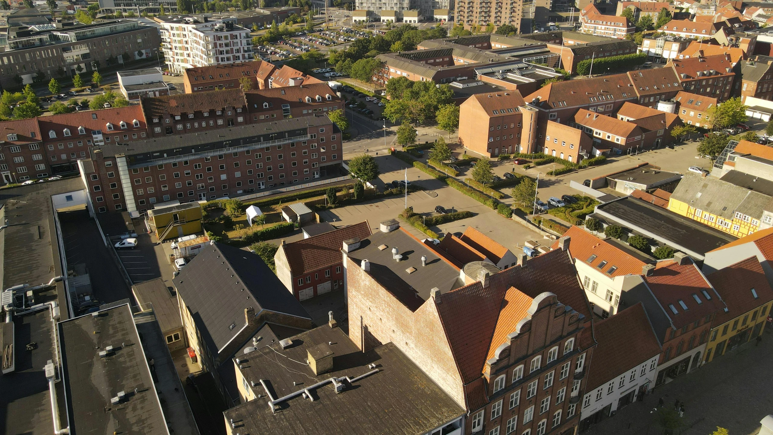 an aerial view of the town with buildings and roofs