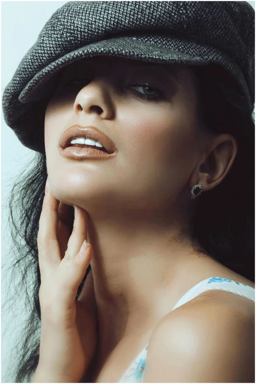 a woman in a hat looking away from the camera