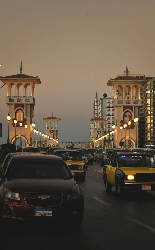 a number of cars in traffic on a city street