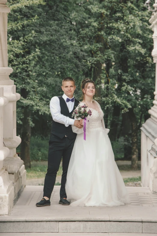 bride and groom outside looking in one another's eyes