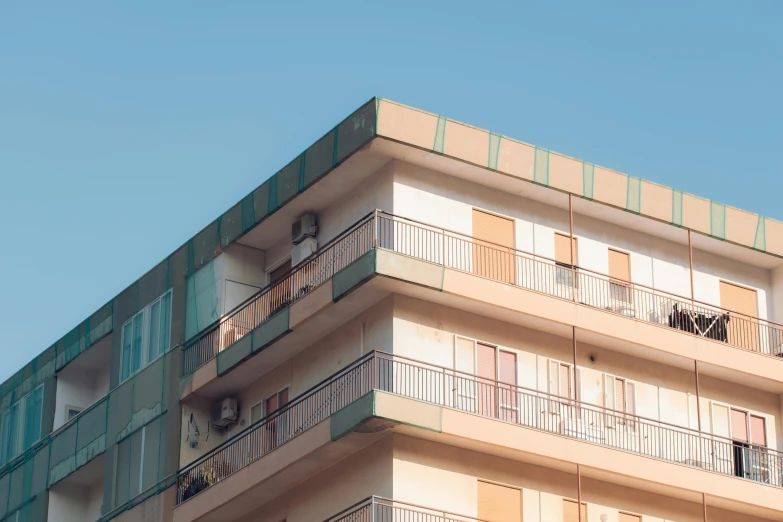 an apartment building is seen against the sky