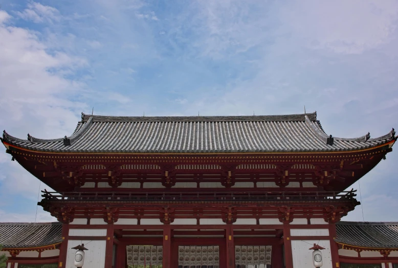 a pagoda with a clock on top of it