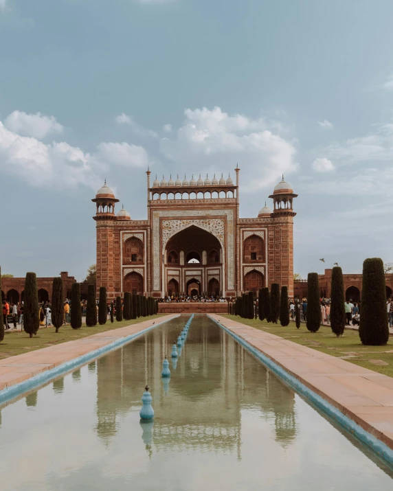 a man walks through an elaborately designed water feature