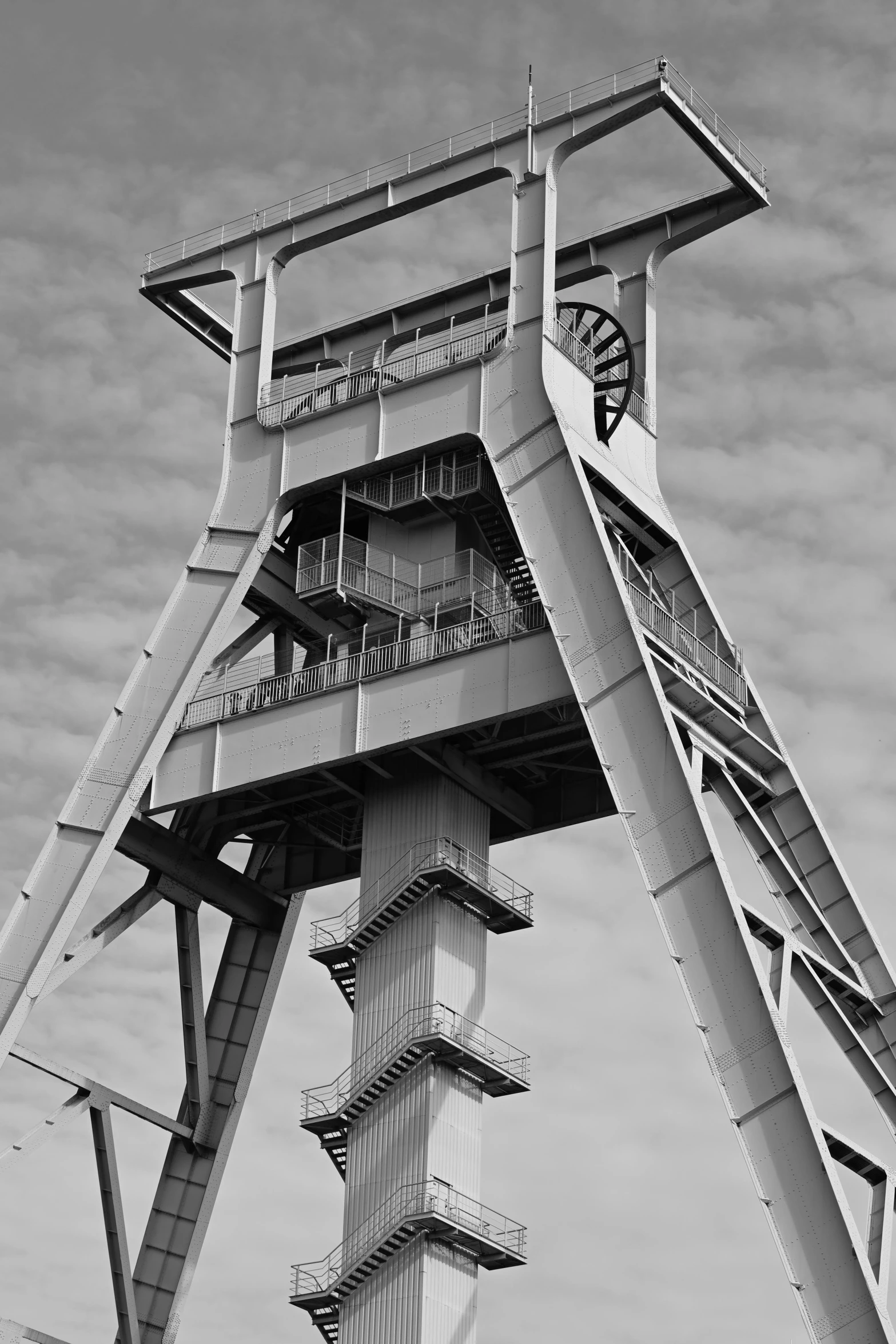 the bottom part of a tower with a clock on it