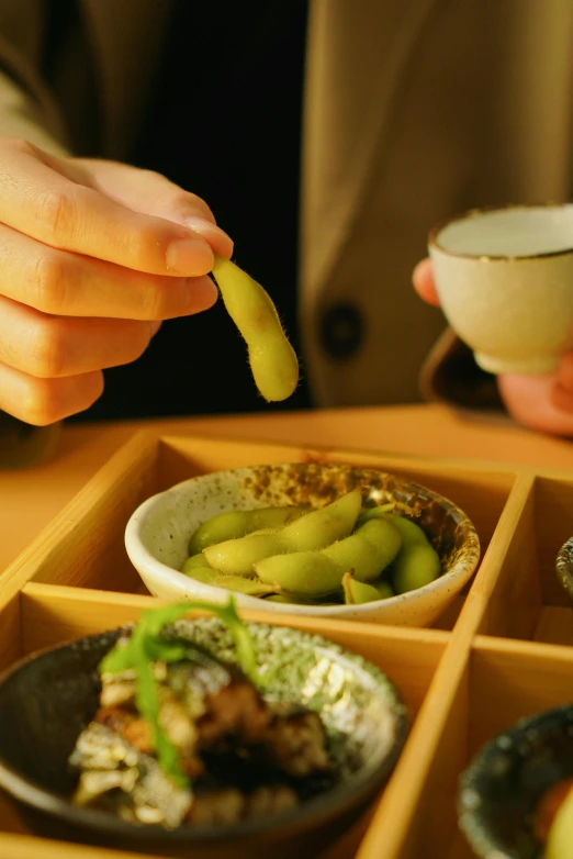 a person that is putting food in bowls