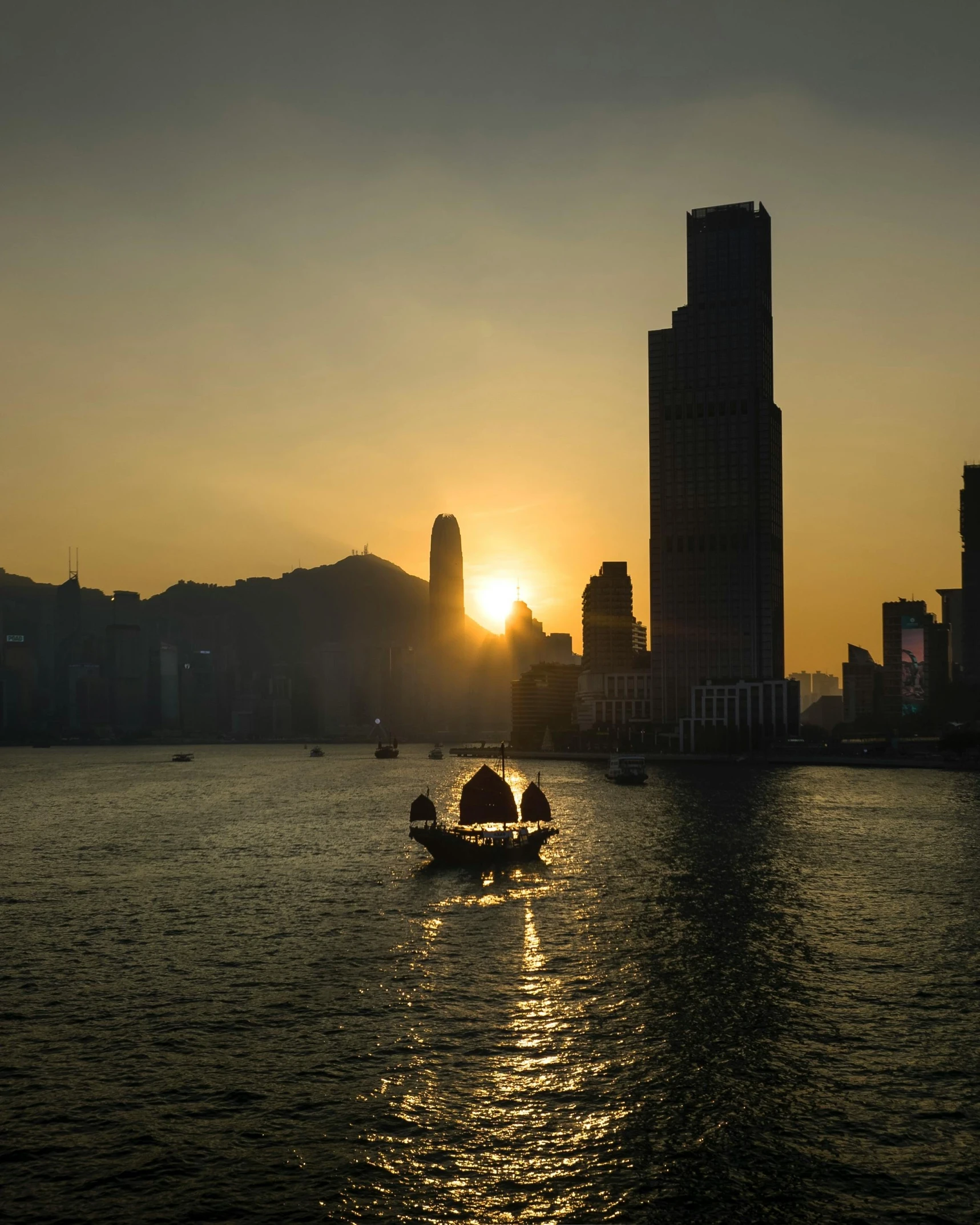 three people in a small boat on water