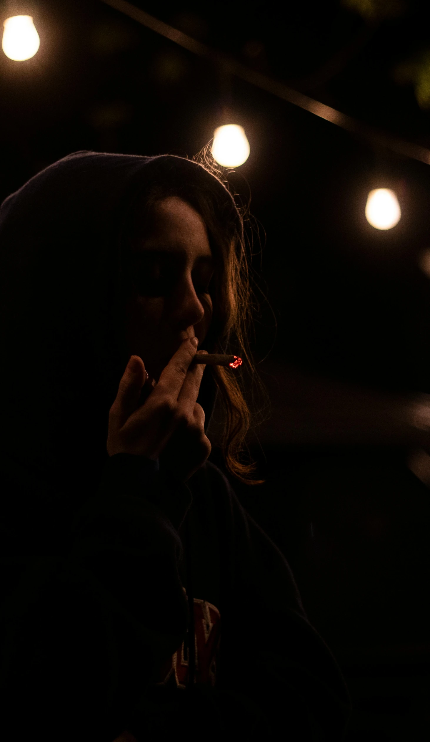 a woman with her finger up while smoking
