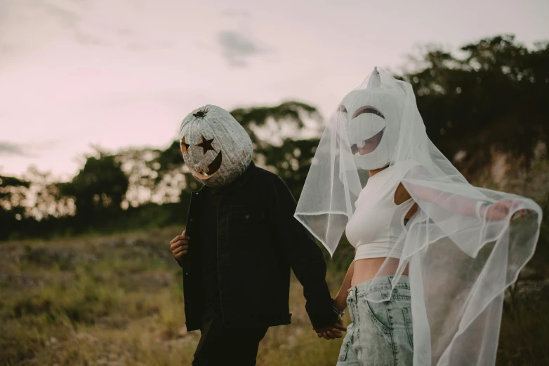 a bride and groom walk out for a walk