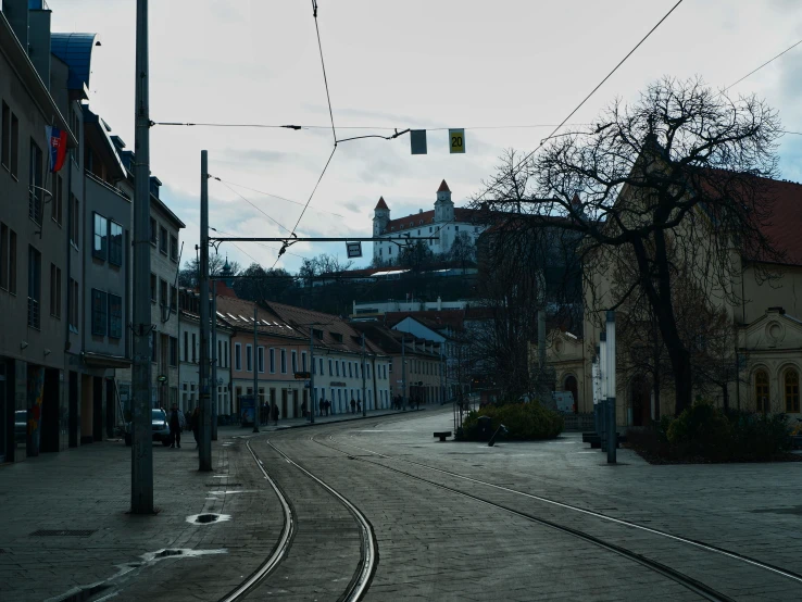 a empty street in the middle of an older town