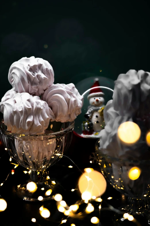 a glass bowl filled with balls of meringue