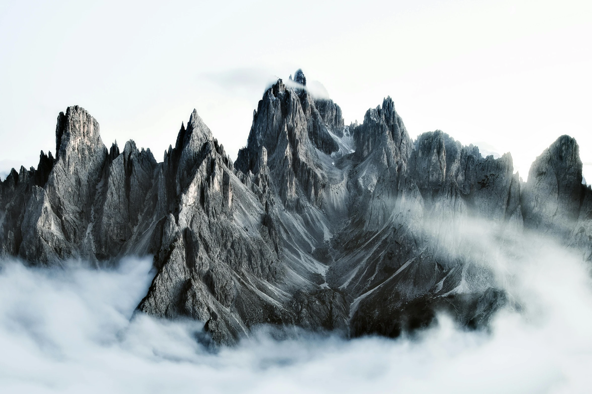 mountain peaks covered in thick fog on a foggy day