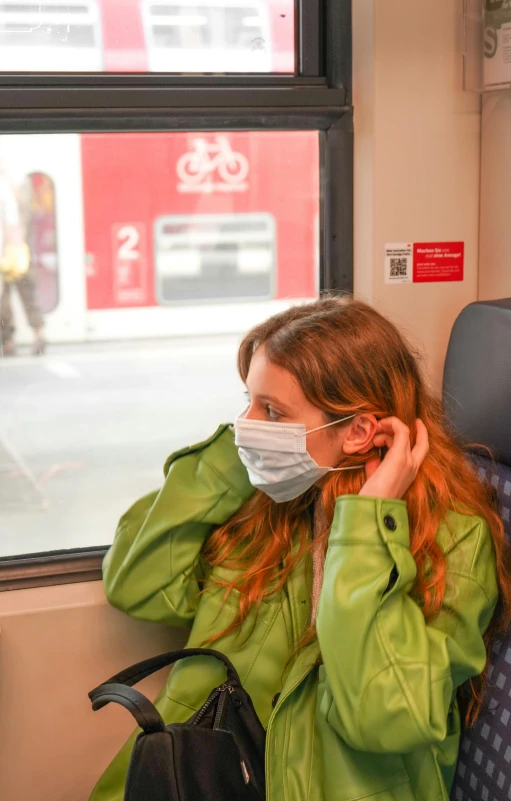 woman wearing surgical mask on public transportation