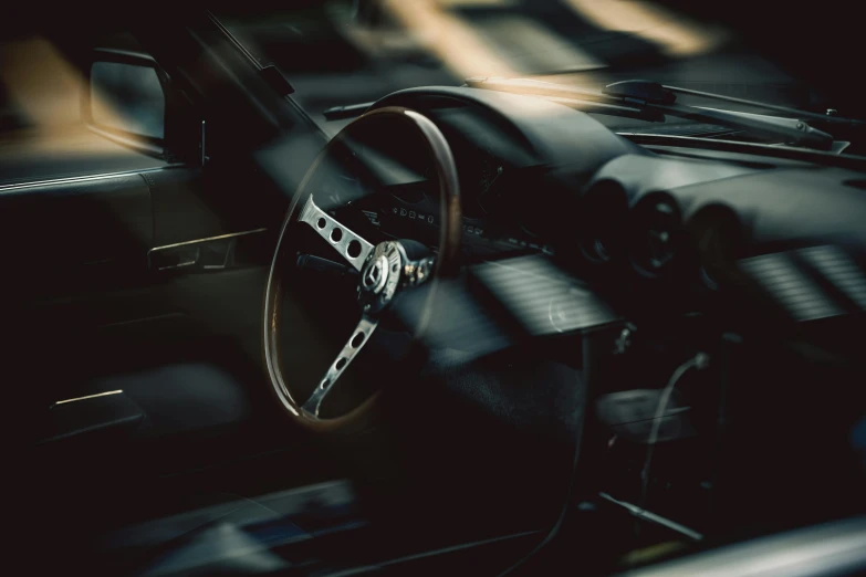 a car's dashboard with the steering wheel and dashboard lights up