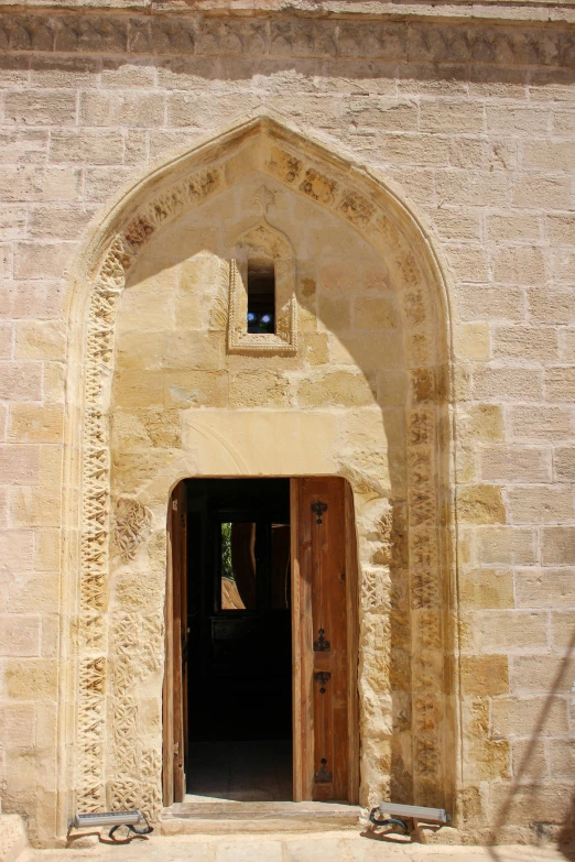 the doorway to an old stone building