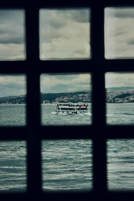 an ocean scene is seen through the window