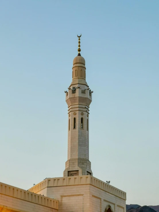 a large brick building with a bell on top