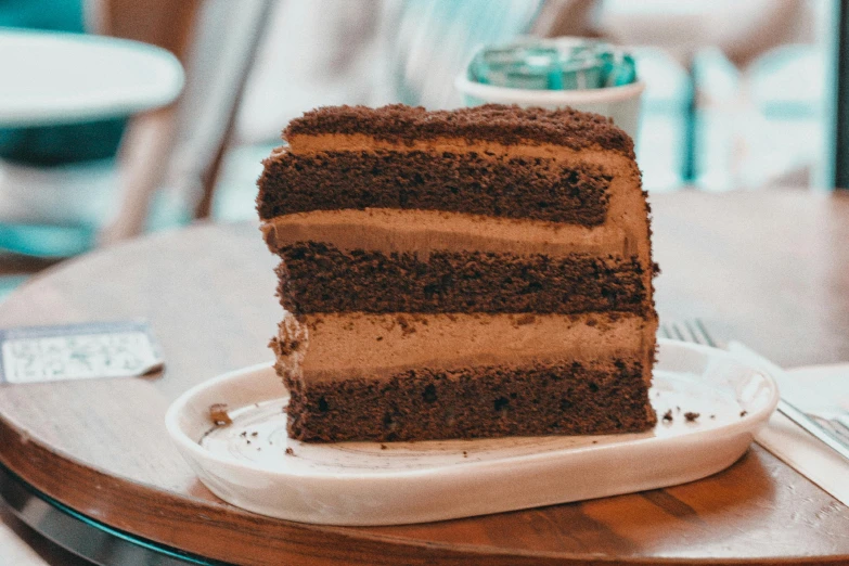 a slice of cake is on a plate on a table