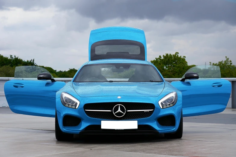 a bright blue mercedes sports utility vehicle