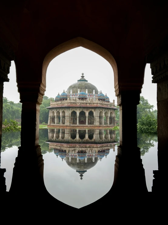 an old stone building that is in the water