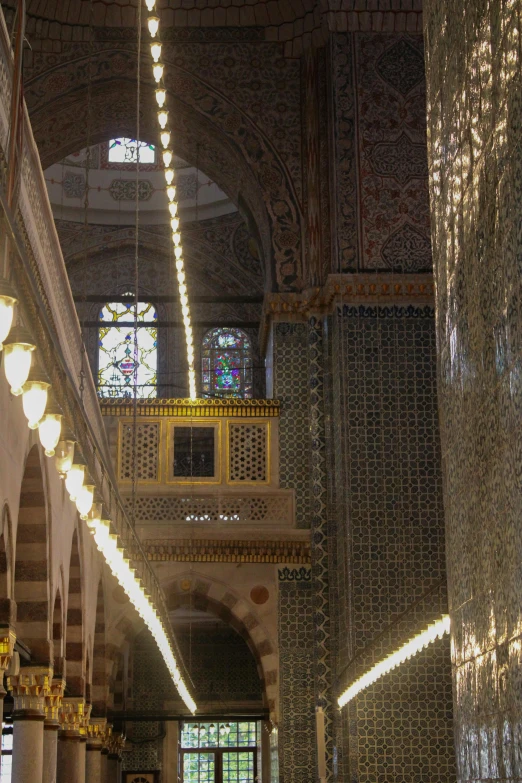 the inside of an elaborate building is lit up with lights