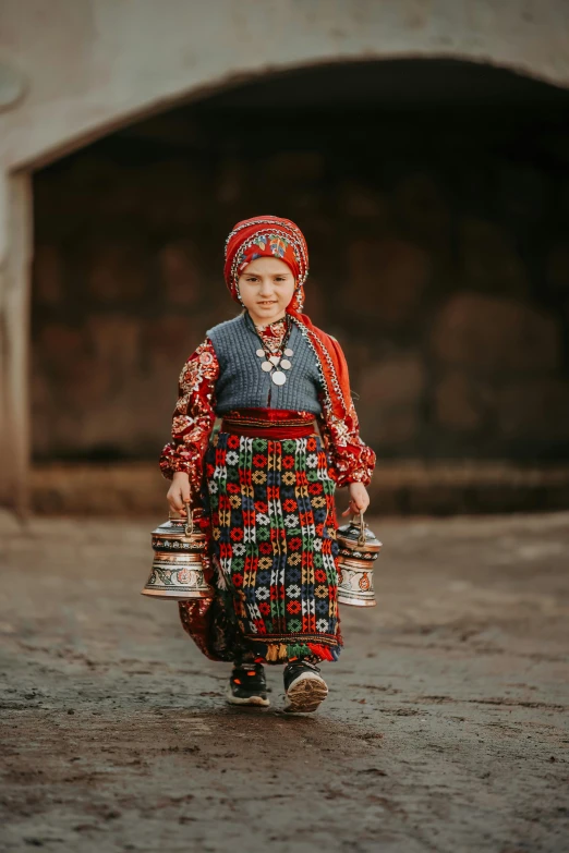 a young woman dressed in an ethnic costume