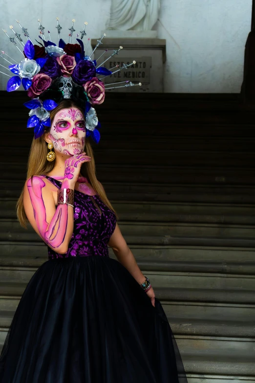 girl in dress and rose skull painted on her face