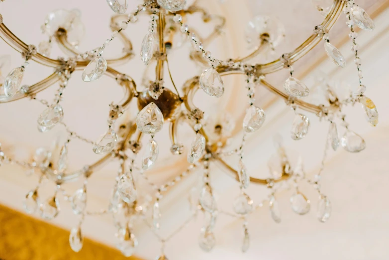 the small crystal chandelier is hanging in the room