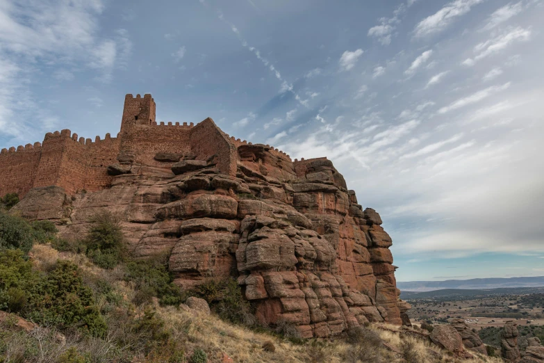 a large castle like structure high on a hill