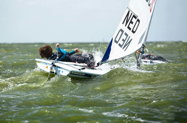 two people that are sailing in the ocean