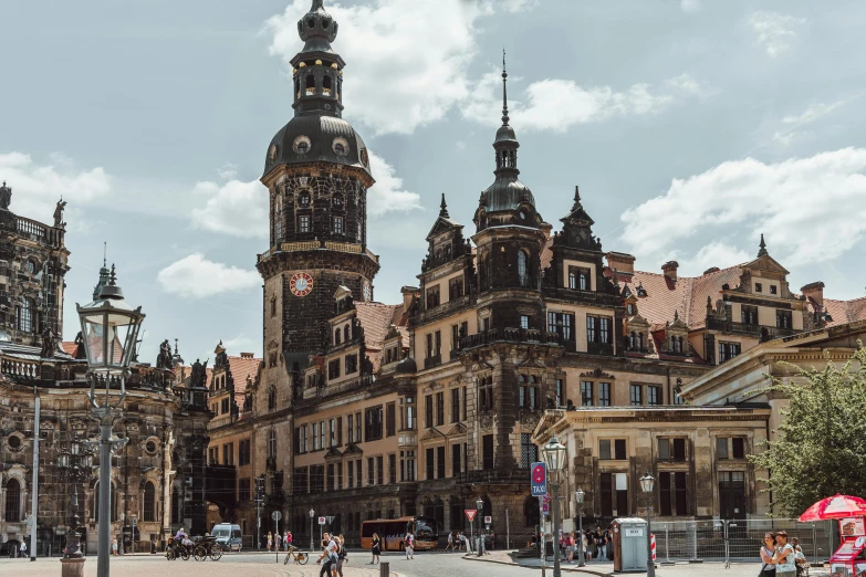 the building has a huge clock tower that points to the top