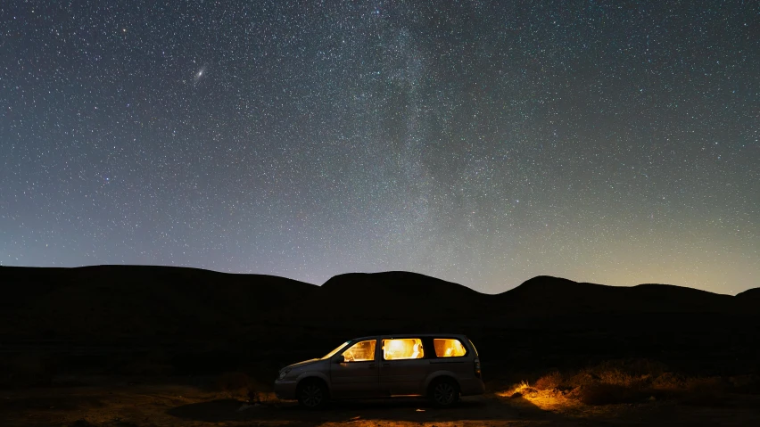 the car is parked in a dimly lit area